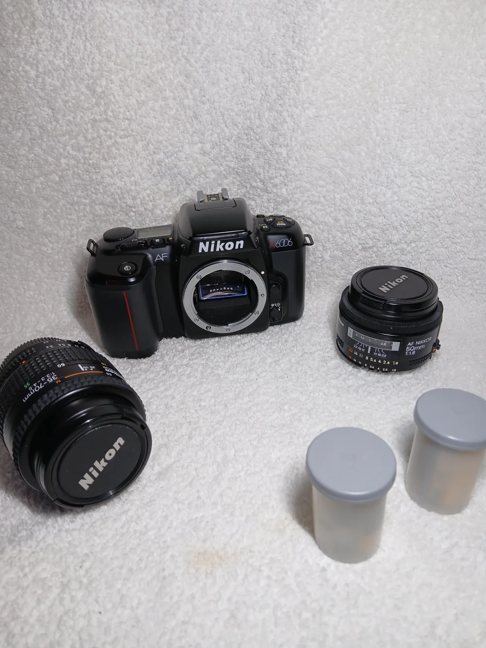 Nikon N6006 35mm autofocus SLR film camera. With Extra Lens and 2 Rolls Of Film.